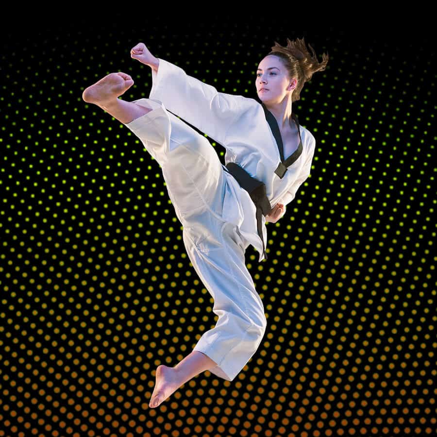 Martial Arts Lessons for Adults in Nutley NJ - Girl Black Belt Jumping High Kick