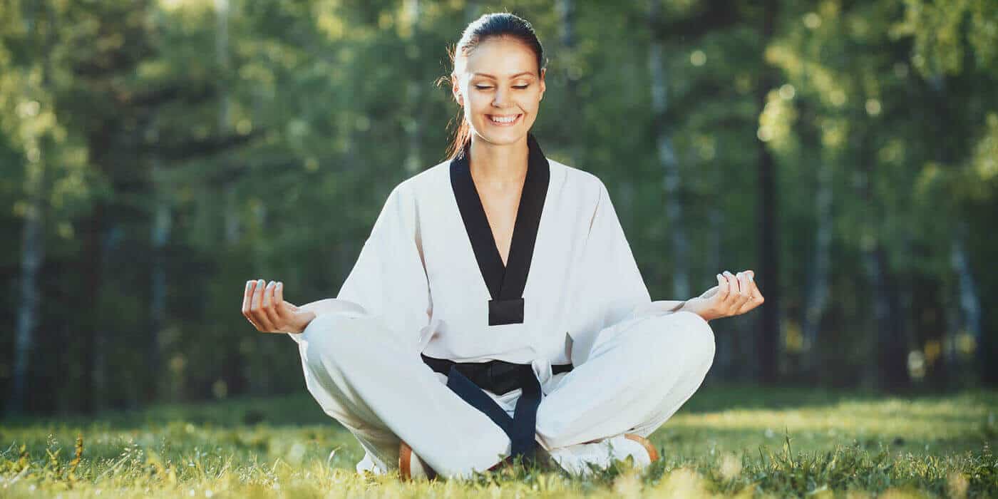 Martial Arts Lessons for Adults in Nutley NJ - Happy Woman Meditated Sitting Background